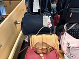 a lot of bags that are sitting on a table
