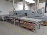 an image of a machine that is cutting wood in a factory