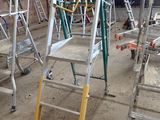 many ladders that are sitting in a building