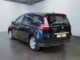 a picture of a black car parked in a garage