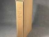 a cardboard box that has a book inside of it