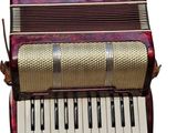 an image of a close up of an accordion on a white background