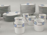 a lot of cups and saucers sitting on a table
