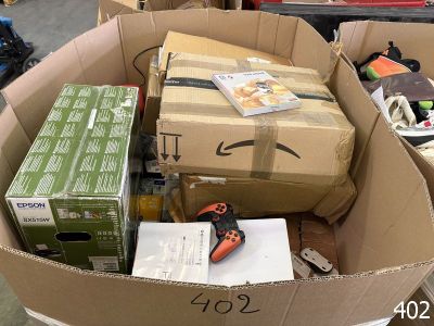 a cardboard box full of boxes and tools in a warehouse