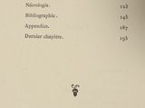 a black and white photo of a book with a bee on it