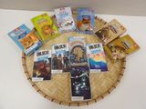 a lot of books that are sitting on a wicker basket