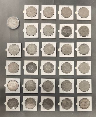 a lot of coins that are sitting on a table