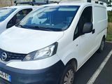 two white vans parked in a parking lot next to each other