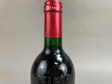 a bottle of wine that is sitting on a table