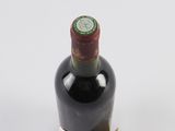 a bottle of wine that is sitting on a table