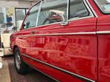 an image of a red car parked in a garage
