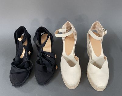 three pairs of black and white shoes with bows on them