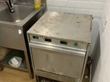 a kitchen with a sink and a dishwasher in it