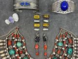 a collection of jewelry including bracelets, bracelets, and rings