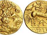 a gold coin with an image of a man on a horse