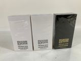 two boxes of makeup products sitting on top of a white table