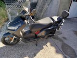 a motorcycle that is parked in front of a building