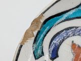 a close up of a decorative plate with flowers on it
