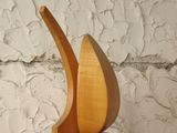 a wooden sculpture of a bird on a wooden table
