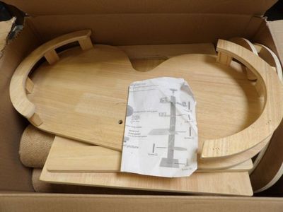 a cardboard box with a wooden train set inside of it