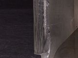 a glass vase that has some kind of rock on it