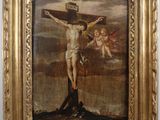 une image représentant un tableau de Jésus sur la croix accroché à un mur