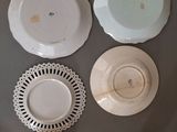 many plates and cups that are on the table