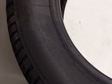 a close up of a tire tire on a white surface