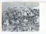 a black and white photo of a mountain in a book