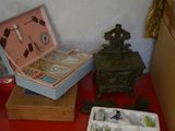a red table with a box of jewelry and a box of jewelry on it