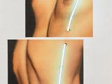 a picture of a woman with a neon strip on her chest