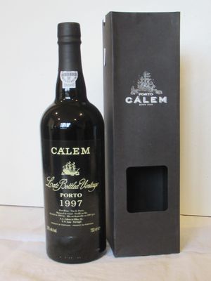 a bottle of wine that is next to a box