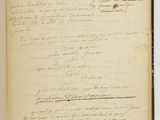 an old book with writing on it sitting on top of a table