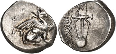 a silver coin with an image of a man holding a sword