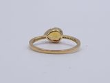 an image of a gold ring with a heart shaped stone