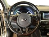 the interior of a car with a steering wheel and dashboard controls
