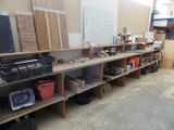 a room with a lot of shelves and bins on it