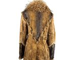 the back view of a mannequin wearing a fur coat