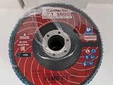 an image of a metal grinding disc on display in a box