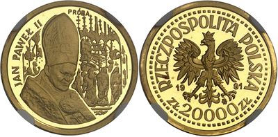 a close up of two gold coins with a pope on them