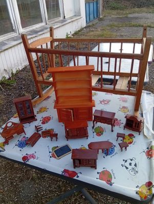 a table with a lot of wooden furniture on it