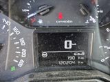 a close up of a car dashboard with a clock on it