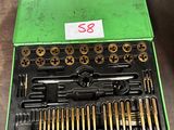 a green box with a bunch of tools in it