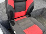 a red and black seat on the back of a boat