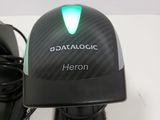 a close up of a computer mouse with a green light on it