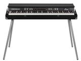the yamaha keyboard is sitting on top of a metal stand