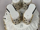 four pairs of shoes on top of a plate