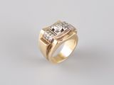 an image of a gold ring with two diamonds on it