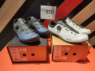 two pairs of shoes are on display in a shoe store