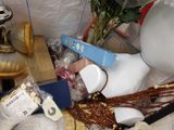 a white mannequin with a blue handle and some beads
